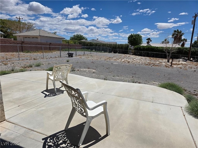 view of patio / terrace featuring fence