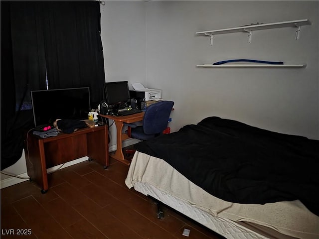 bedroom featuring dark wood-style floors