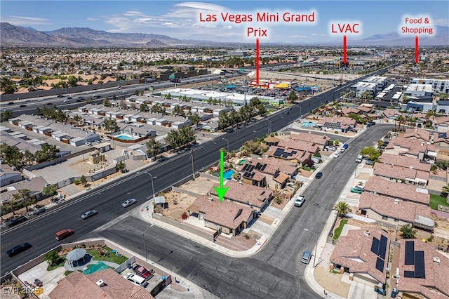 bird's eye view with a residential view and a mountain view