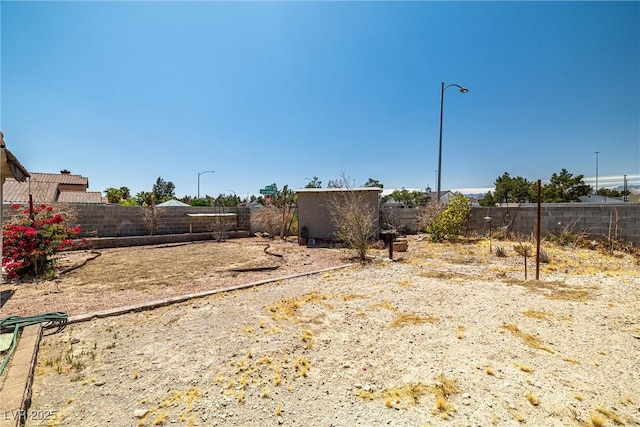 view of yard with a fenced backyard