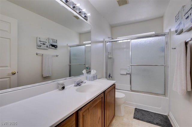 bathroom with vanity, toilet, tile patterned floors, enclosed tub / shower combo, and visible vents