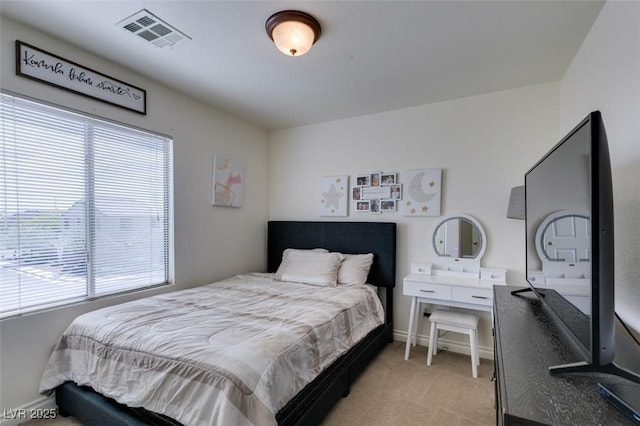 bedroom featuring baseboards, multiple windows, light colored carpet, and visible vents