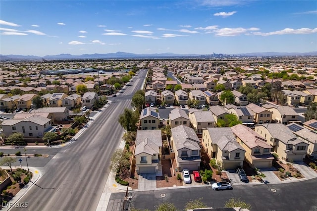 drone / aerial view with a mountain view and a residential view