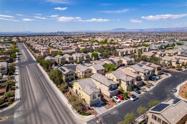drone / aerial view with a residential view and a mountain view