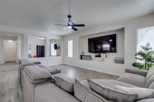 2929 Salado Creek Ave, North Las Vegas, NV 89081 - living area featuring wood finished floors, baseboards, and a ceiling fan