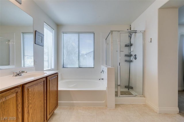 2929 Salado Creek Ave, North Las Vegas, NV 89081 - full bathroom featuring a stall shower, tile patterned flooring, a garden tub, and vanity