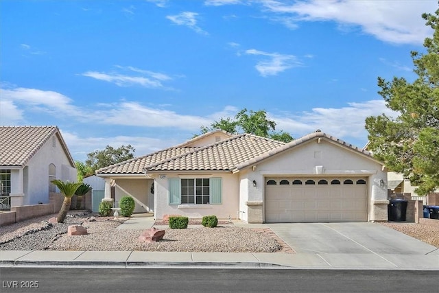1326 Winter Solstice Ave, Henderson, NV 89014 - ranch-style house with concrete driveway, a tiled roof, an attached garage, and stucco siding