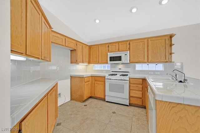 1326 Winter Solstice Ave, Henderson, NV 89014 - kitchen featuring open shelves, white appliances, light tile patterned floors, backsplash, and vaulted ceiling