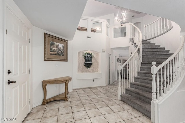 1066 Aspen Valley Ave, Las Vegas, NV 89123 - foyer entrance with a chandelier, visible vents, light tile patterned floors, and stairway
