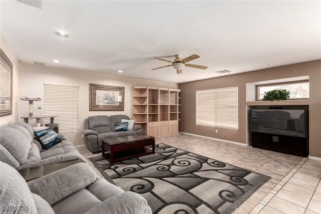 1066 Aspen Valley Ave, Las Vegas, NV 89123 - living room with visible vents, light tile patterned flooring, baseboards, recessed lighting, and a ceiling fan