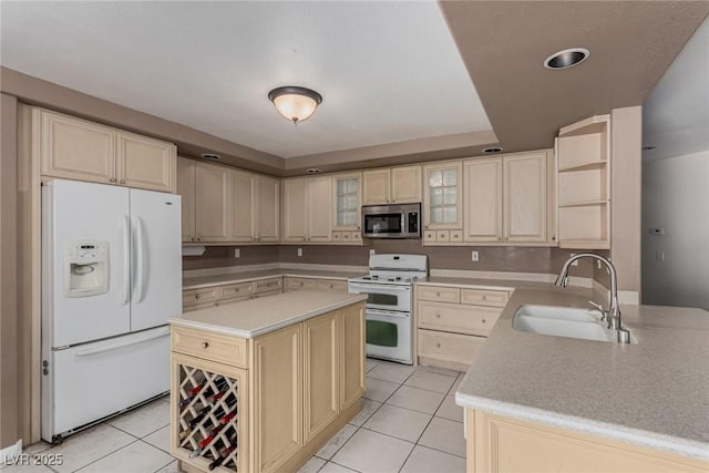 1066 Aspen Valley Ave, Las Vegas, NV 89123 - kitchen with a sink, light tile patterned floors, white appliances, and light countertops