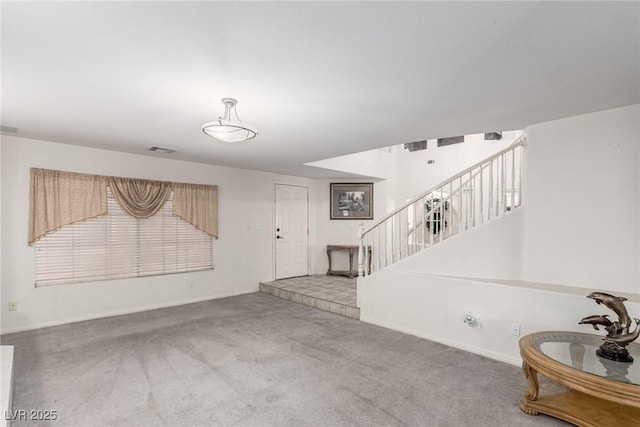 1066 Aspen Valley Ave, Las Vegas, NV 89123 - carpeted living room with visible vents, stairs, and baseboards
