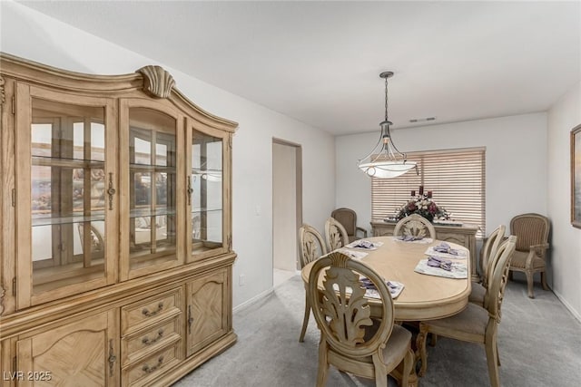 1066 Aspen Valley Ave, Las Vegas, NV 89123 - dining space featuring baseboards, visible vents, and light carpet