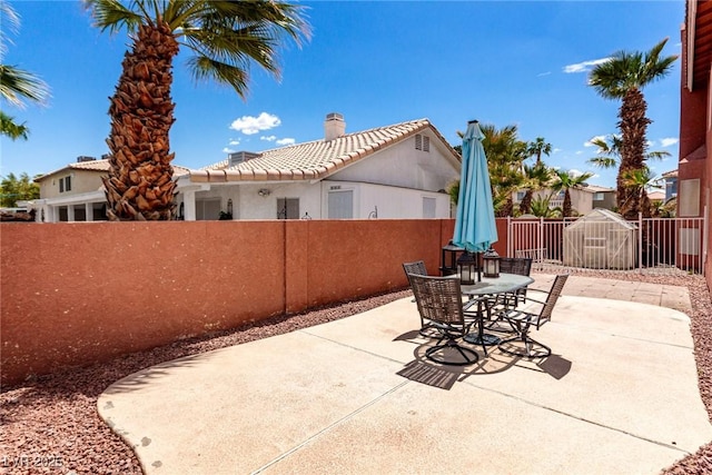 1066 Aspen Valley Ave, Las Vegas, NV 89123 - view of patio featuring outdoor dining area and a fenced backyard