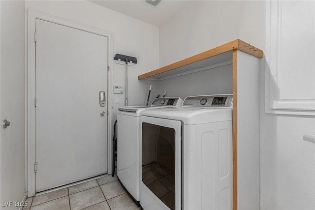 1066 Aspen Valley Ave, Las Vegas, NV 89123 - clothes washing area with washer and dryer, laundry area, visible vents, and light tile patterned floors