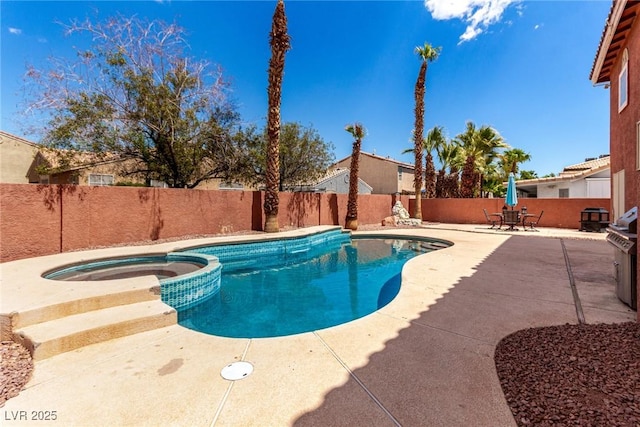 1066 Aspen Valley Ave, Las Vegas, NV 89123 - view of swimming pool with grilling area, a patio, a pool with connected hot tub, and a fenced backyard