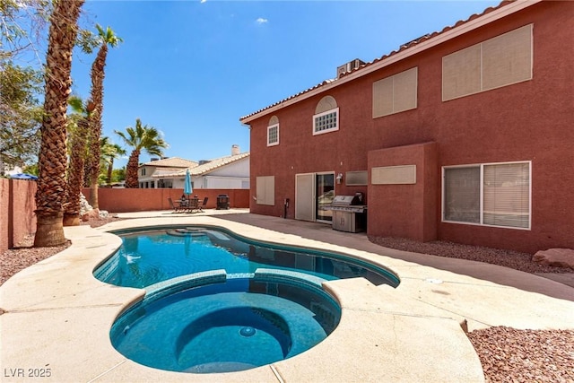1066 Aspen Valley Ave, Las Vegas, NV 89123 - view of pool with a fenced backyard, a patio, a pool with connected hot tub, and a grill