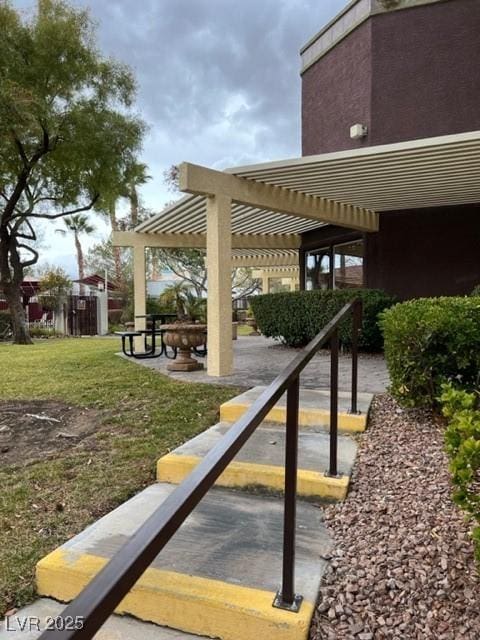 view of community with a yard and a pergola