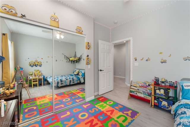 rec room featuring baseboards and wood finished floors