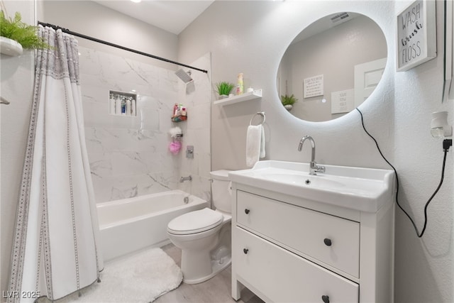 bathroom with shower / bath combo, vanity, toilet, wood finished floors, and visible vents