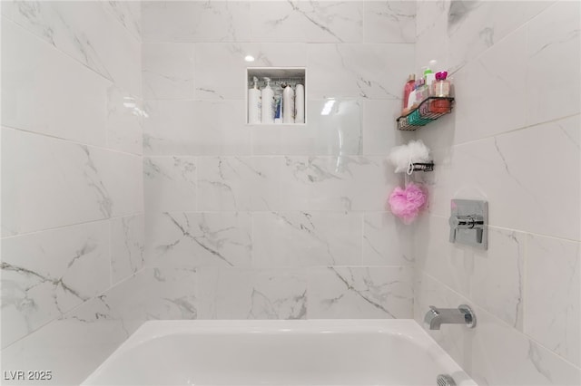 bathroom with tub / shower combination