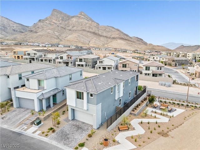 drone / aerial view with a residential view and a mountain view