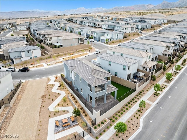 drone / aerial view with a residential view and a mountain view