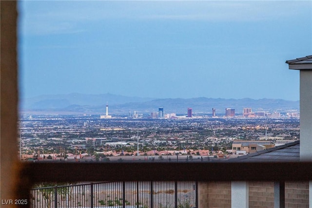 property's view of city with a mountain view