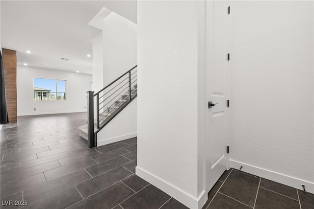 stairs with recessed lighting and baseboards