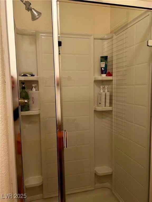 full bath with a shower stall
