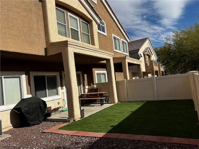 view of yard featuring a patio and a fenced backyard