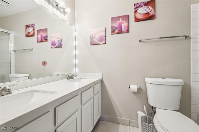 full bath featuring a sink, a shower with shower door, tile patterned flooring, toilet, and visible vents