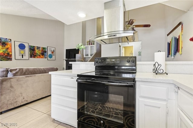 kitchen with ceiling fan, island range hood, black electric range oven, light countertops, and open floor plan