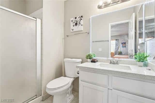 full bathroom with toilet, a shower stall, and vanity