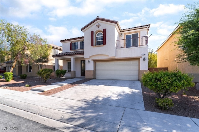 mediterranean / spanish-style home featuring a tiled roof, a garage, a balcony, and stucco siding