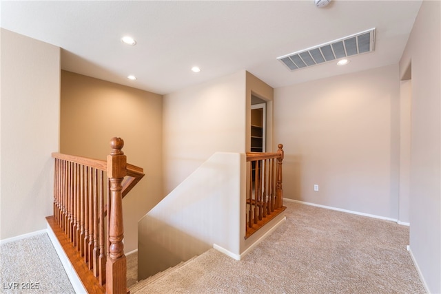 staircase with visible vents, recessed lighting, baseboards, and carpet floors