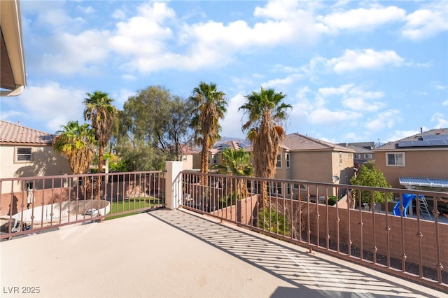 view of patio / terrace featuring a balcony and a residential view