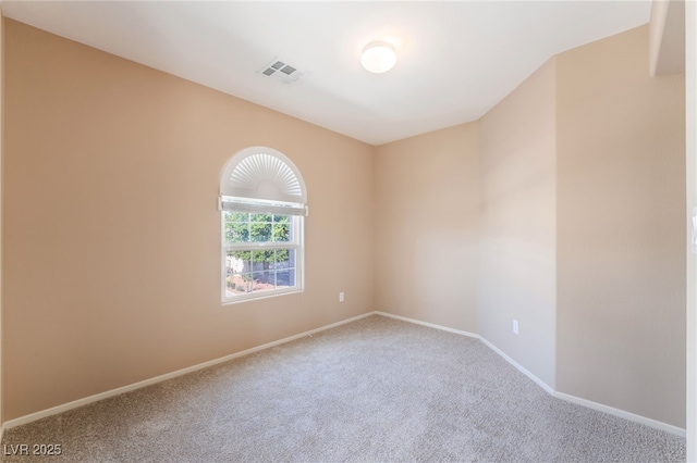 unfurnished room featuring carpet floors, baseboards, and visible vents