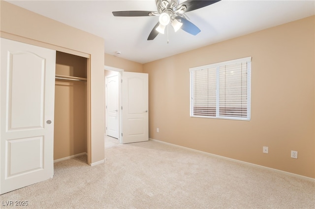 unfurnished bedroom with a closet, baseboards, and light carpet