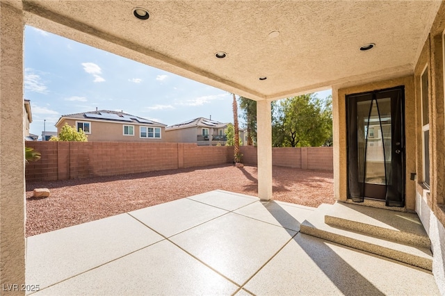 7098 Seabirds Pl, North Las Vegas, NV 89084 - fenced backyard featuring a patio area