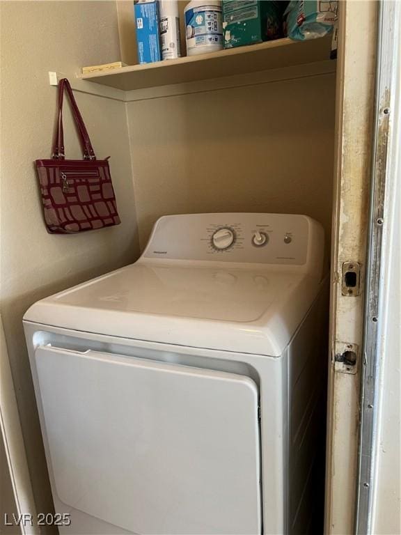 clothes washing area with laundry area and washer / clothes dryer