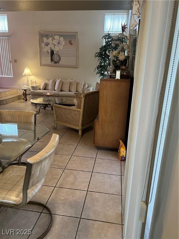 living room featuring light tile patterned flooring