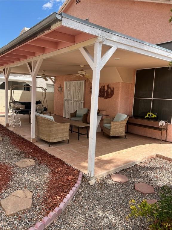 view of patio / terrace with ceiling fan and outdoor lounge area