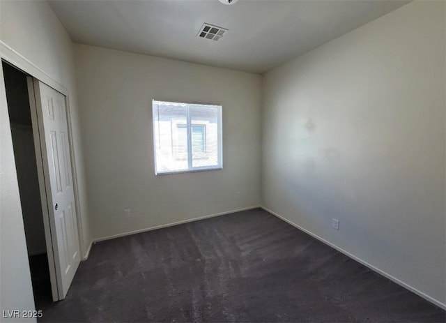 4645 Fuchsia Nights Ave Unit 103, North Las Vegas, NV 89084 - unfurnished bedroom with dark colored carpet and a closet