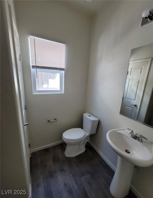 4645 Fuchsia Nights Ave Unit 103, North Las Vegas, NV 89084 - half bath with toilet, wood finished floors, and baseboards