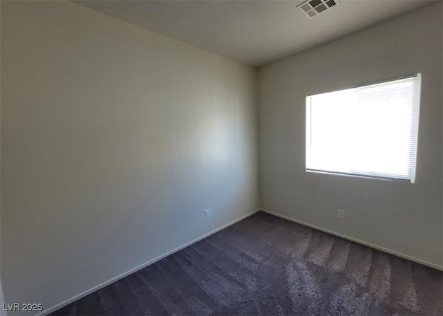 4645 Fuchsia Nights Ave Unit 103, North Las Vegas, NV 89084 - spare room featuring dark colored carpet and baseboards