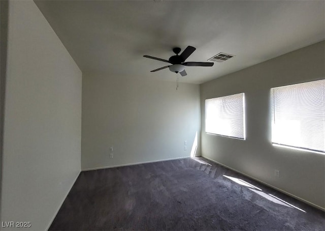 4645 Fuchsia Nights Ave Unit 103, North Las Vegas, NV 89084 - empty room featuring dark colored carpet, a ceiling fan, and baseboards