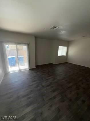 4645 Fuchsia Nights Ave Unit 103, North Las Vegas, NV 89084 - spare room featuring dark wood-type flooring