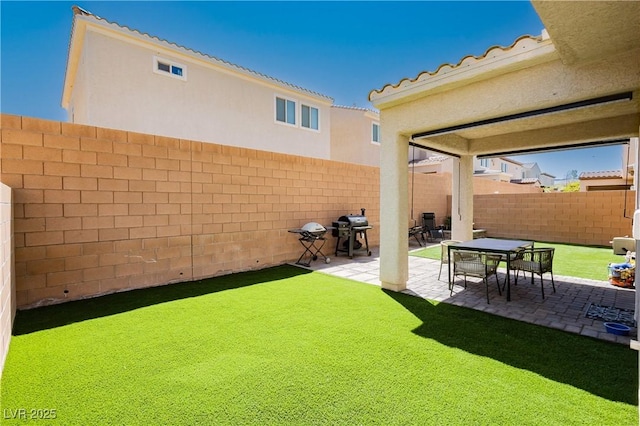 view of yard with a patio and a fenced backyard