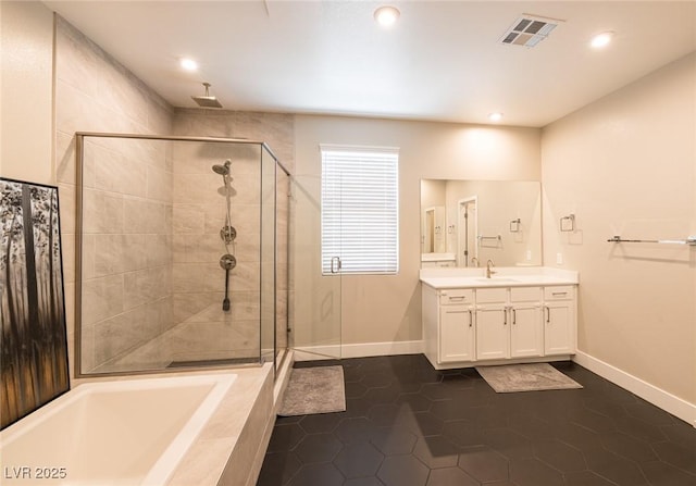 2650 Skylark Trail St, Henderson, NV 89044 - bathroom with a stall shower, vanity, a garden tub, baseboards, and recessed lighting